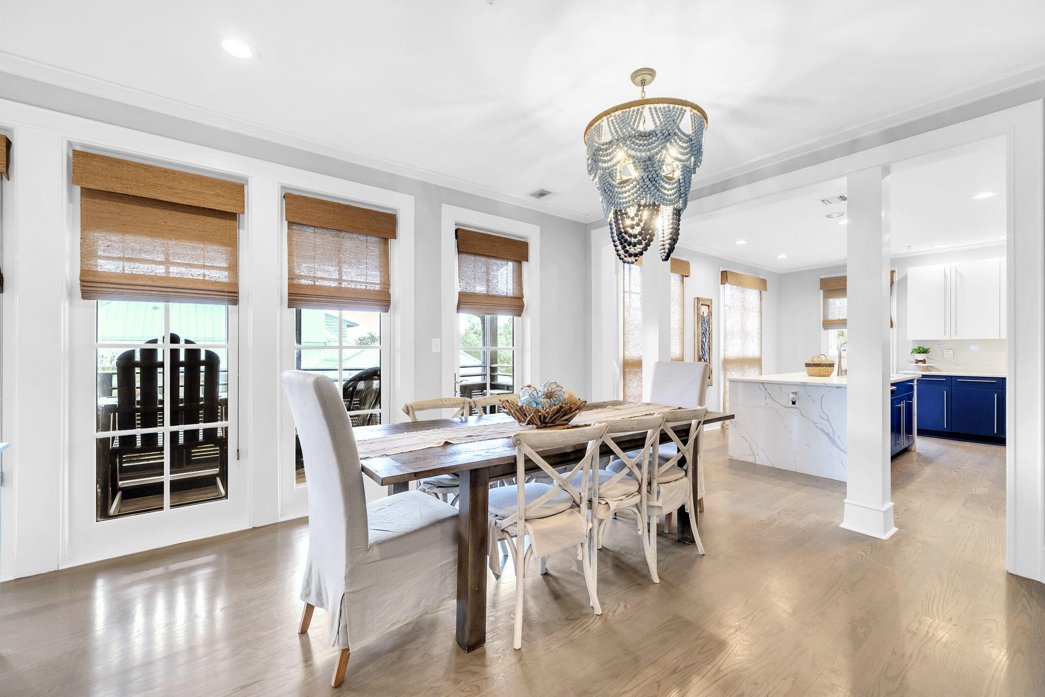 82 South Barrett Square, Unit 3E Inlet Beach, FL 32461 - Photo 14 of 56 a view of a dining room with furniture and a chandelier
