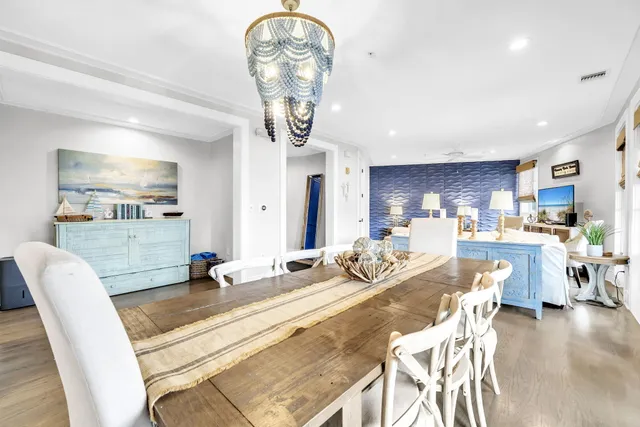 a bedroom with a bed couch and a large window