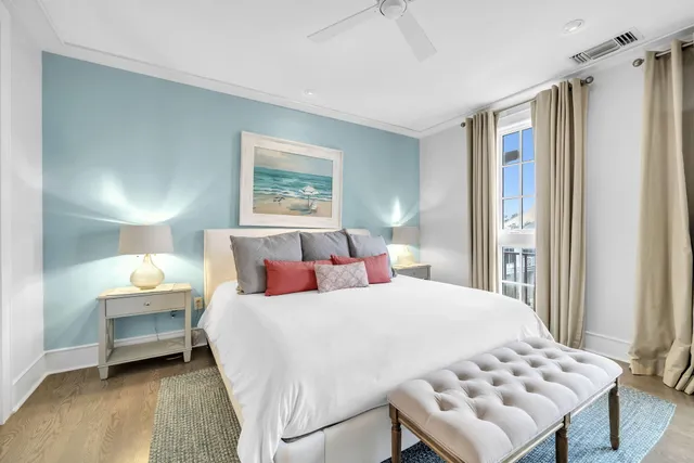 a spacious bedroom with a bed and a large window