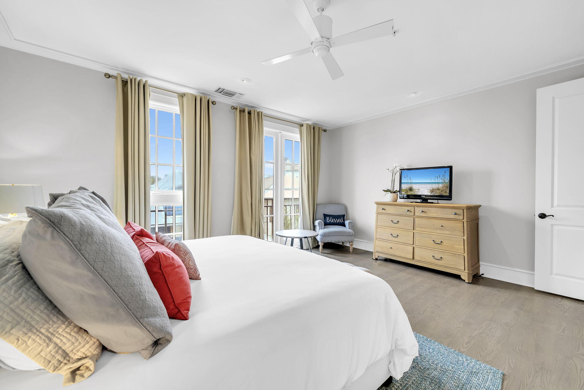 82 South Barrett Square, Unit 3E Inlet Beach, FL 32461 - Photo 19 of 56 a spacious bedroom with a bed and a large window