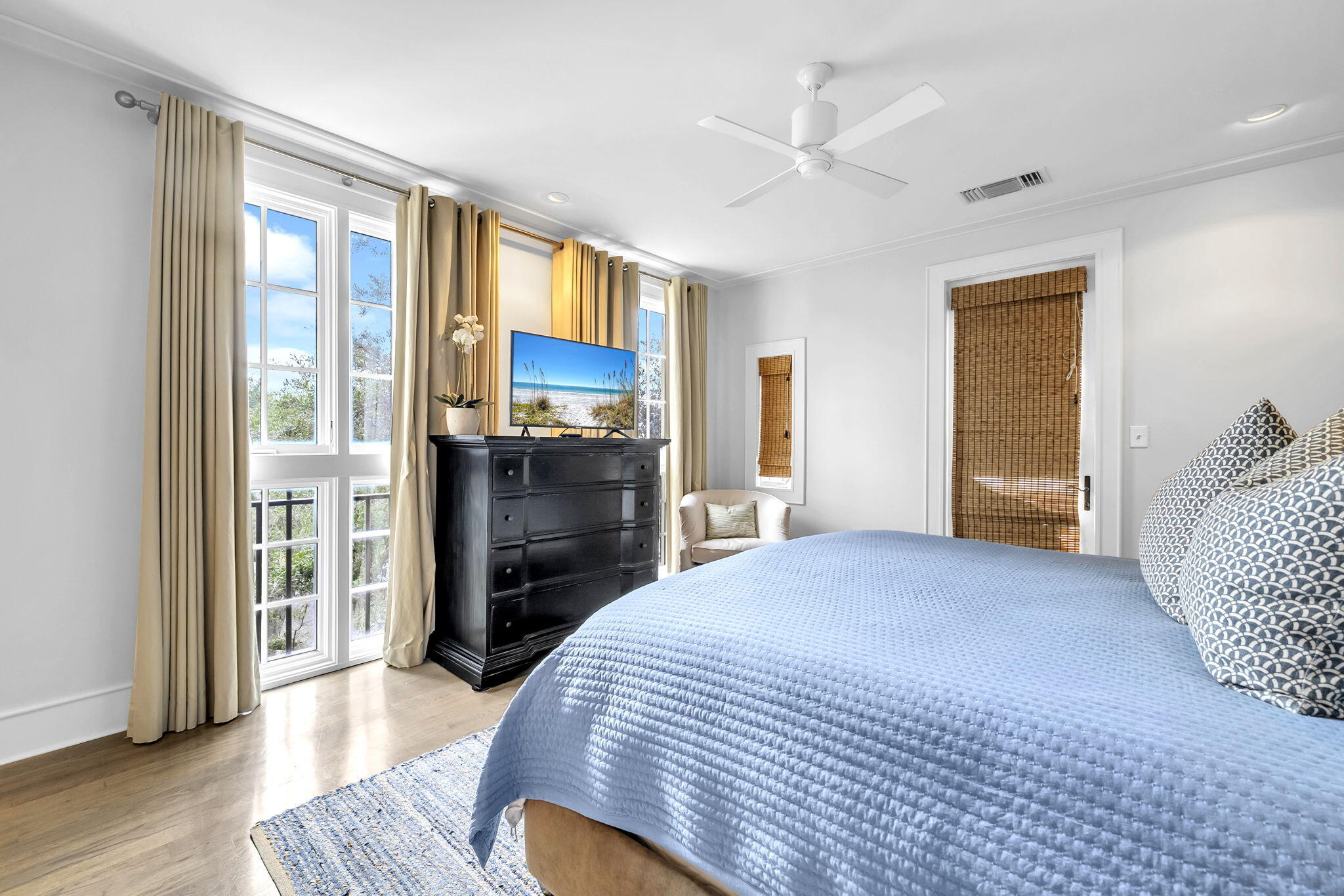 82 South Barrett Square, Unit 3E Inlet Beach, FL 32461 - Photo 21 of 56 a bedroom with a bed and wooden floor