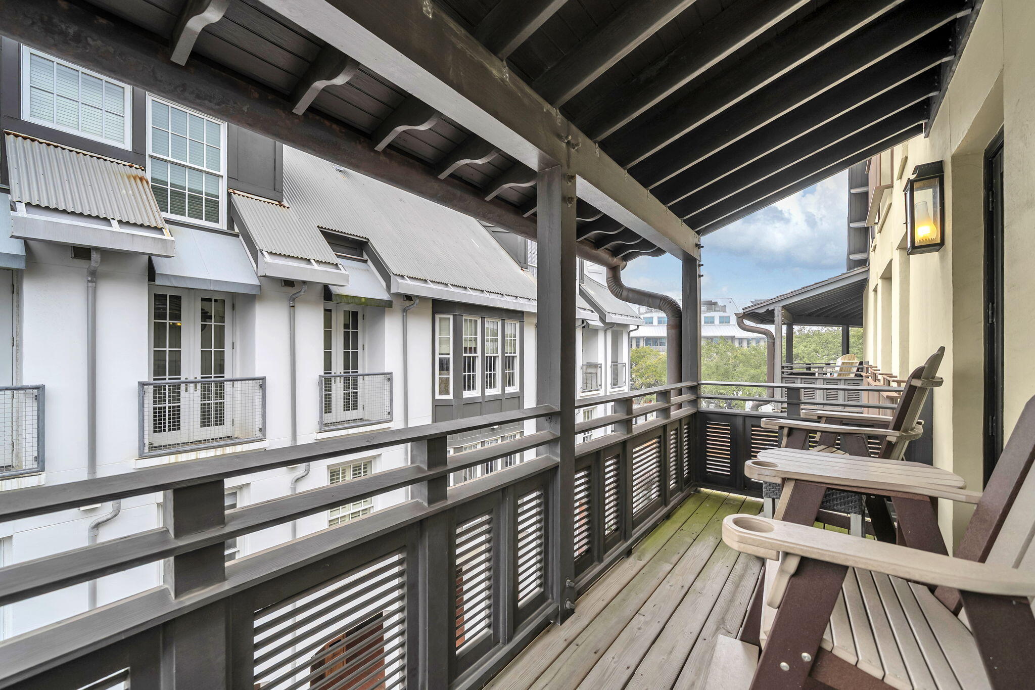 82 South Barrett Square, Unit 3E Inlet Beach, FL 32461 - Photo 34 of 56 a view of a balcony with lots of windows