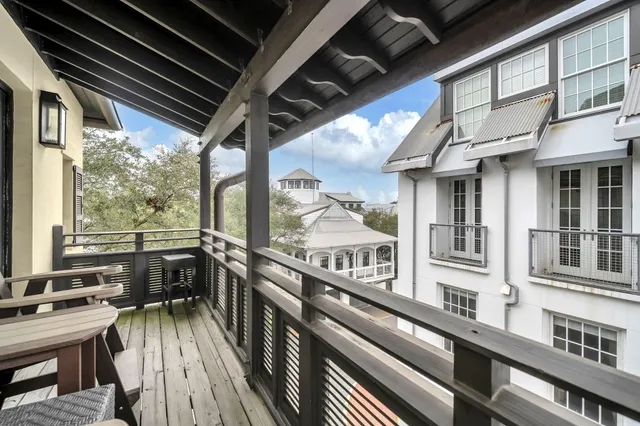 a view of a balcony with furniture