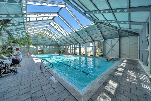 a view of a balcony with furniture and umbrella