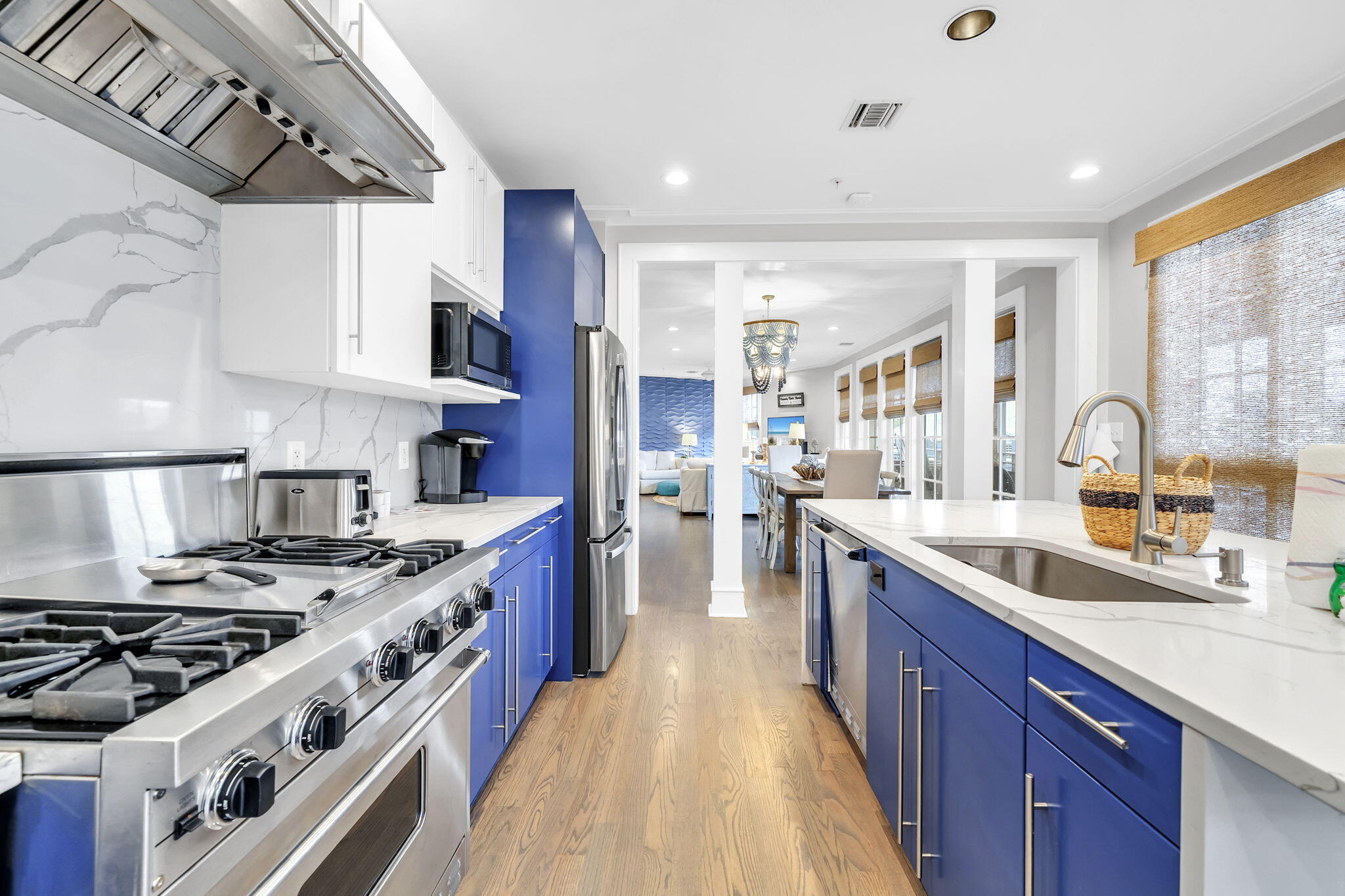 82 South Barrett Square, Unit 3E Inlet Beach, FL 32461 - Photo 5 of 56 a kitchen with stainless steel appliances granite countertop a stove and a sink