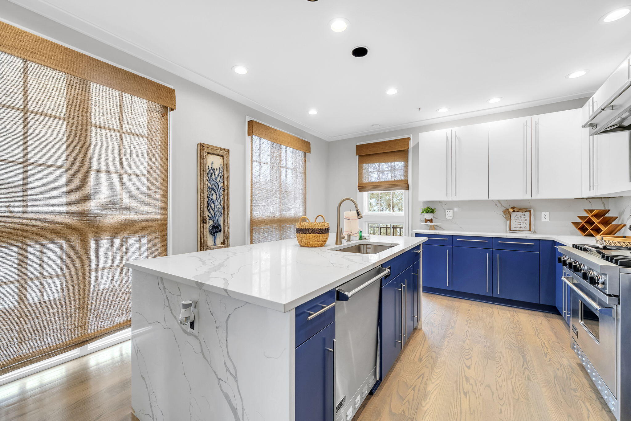 82 South Barrett Square, Unit 3E Inlet Beach, FL 32461 - Photo 7 of 56 a kitchen with a stove a sink a refrigerator and wooden cabinets
