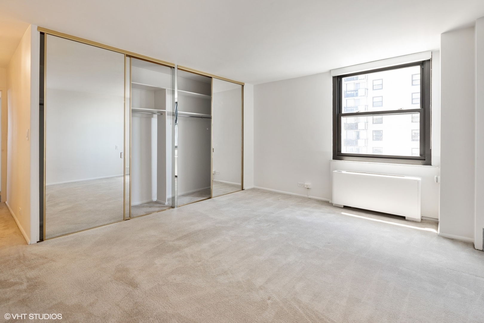 5701 North Sheridan Road, Unit 20J Chicago, IL 60660 - Photo 20 of 25 a view of an empty room with a window