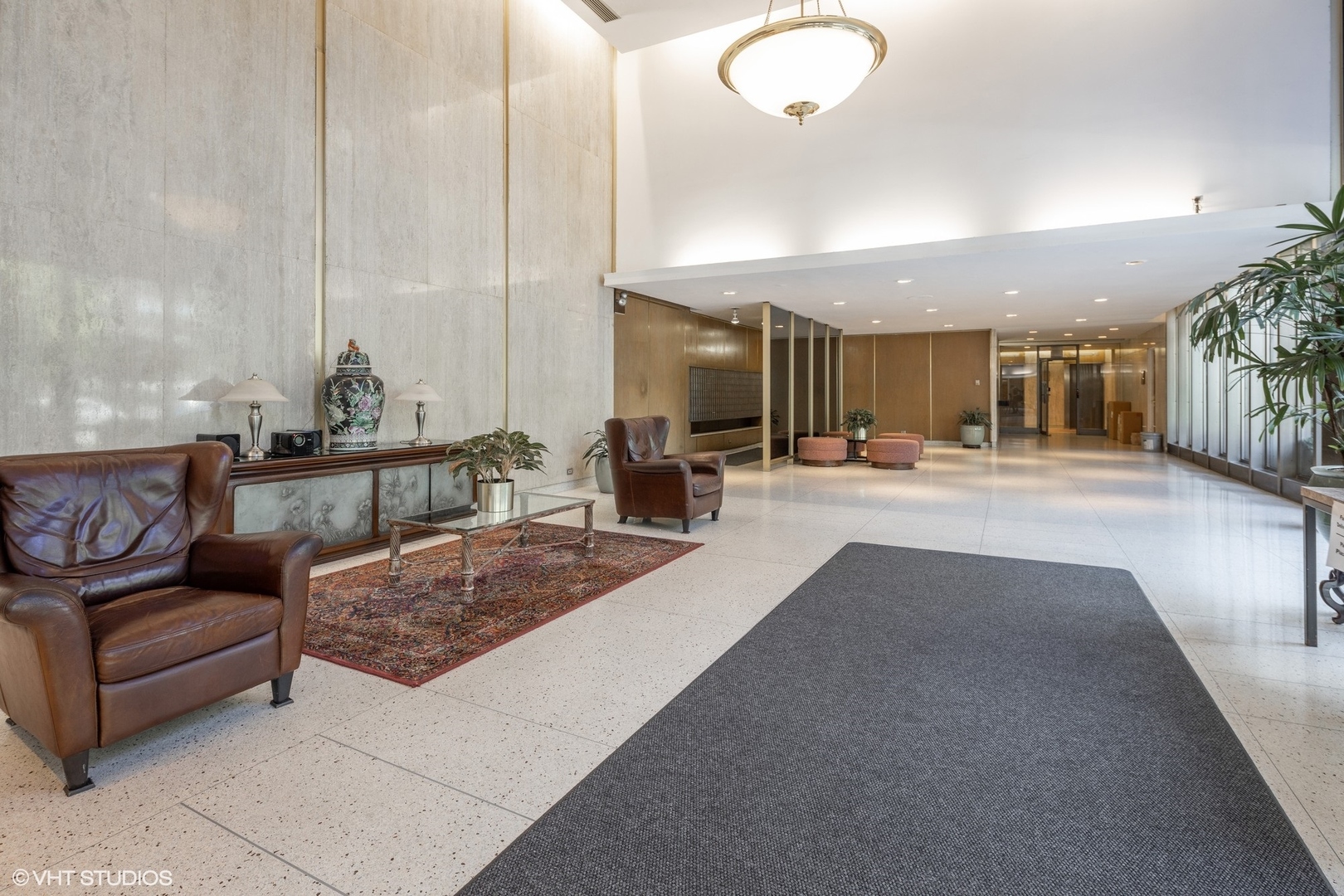 5701 North Sheridan Road, Unit 20J Chicago, IL 60660 - Photo 25 of 25 a living room with couches and kitchen view