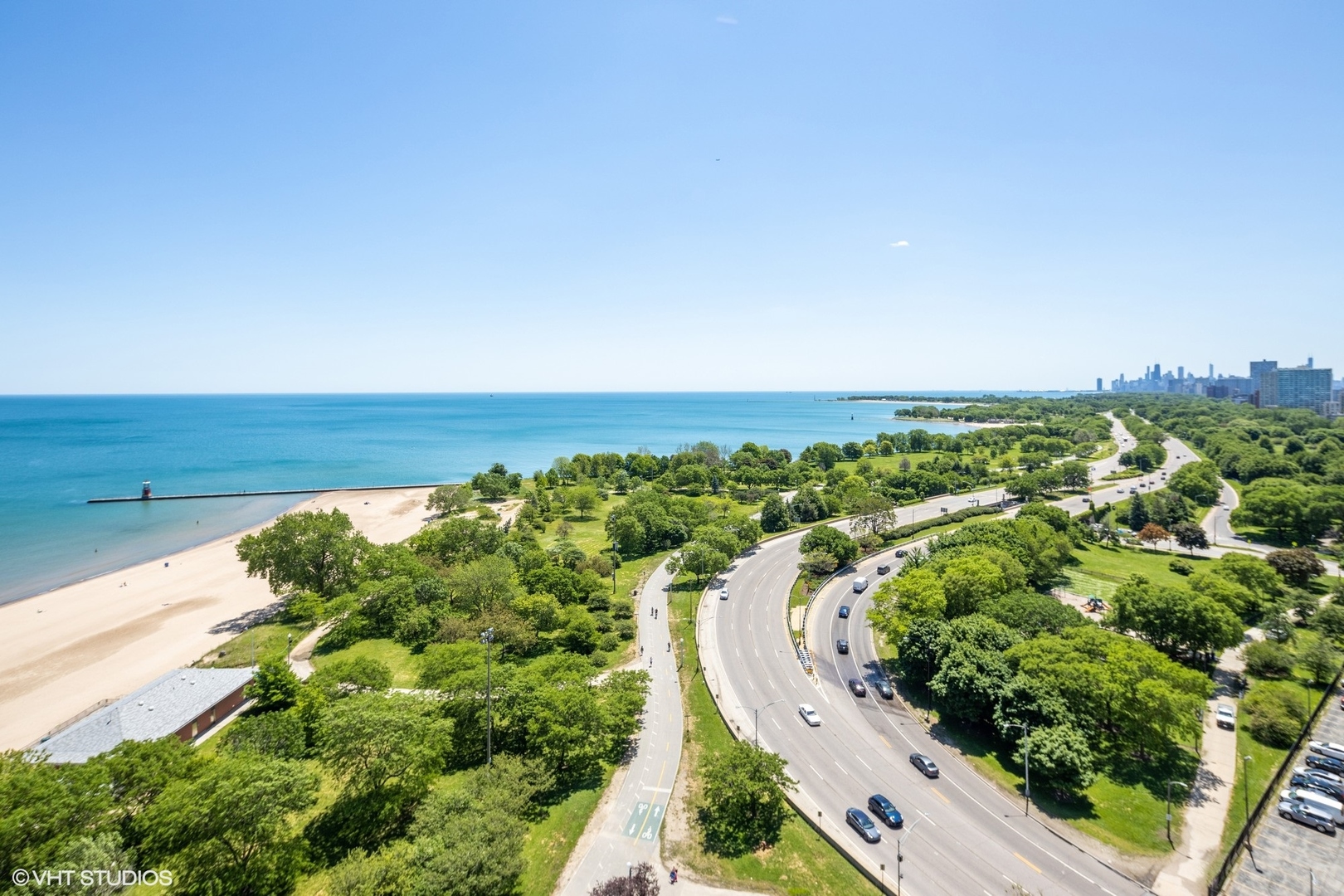 5701 North Sheridan Road, Unit 20J Chicago, IL 60660 - Photo 6 of 25 a view of a lake with a yard