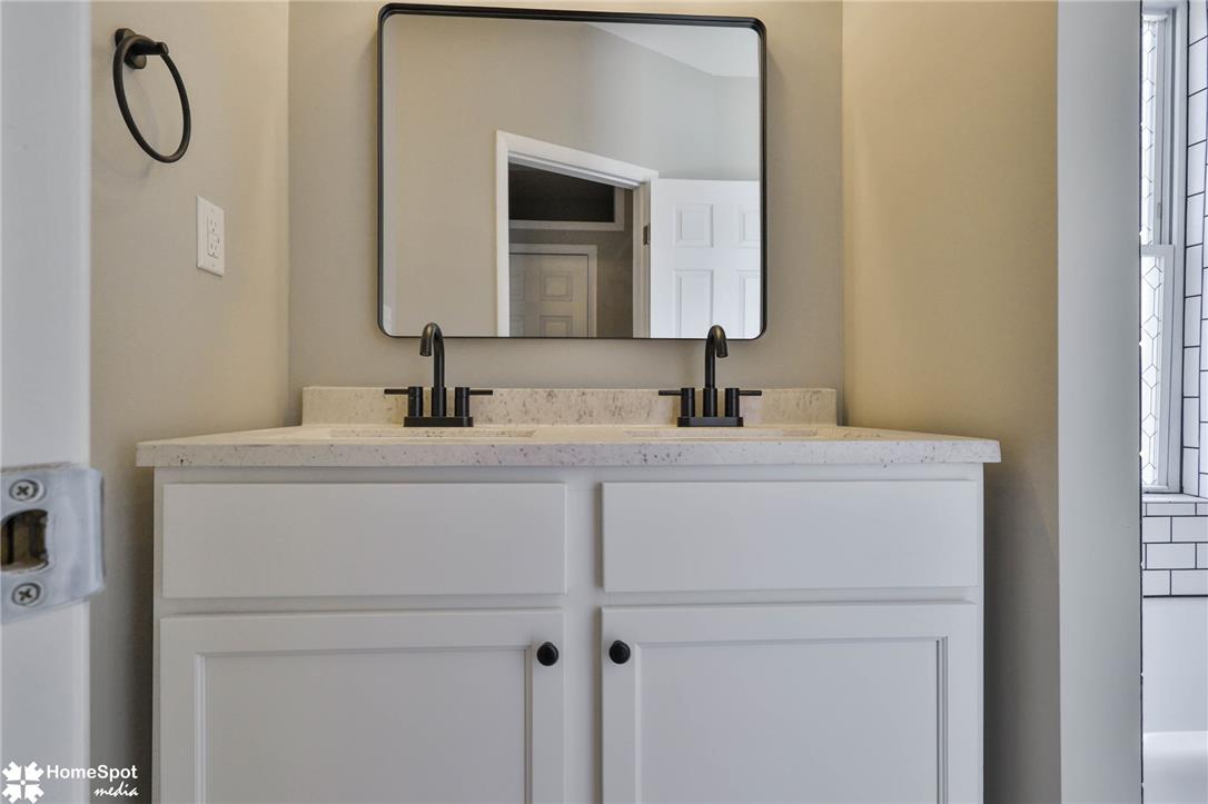 619 Sioux Street Bethlehem, PA 18015 - Photo 32 of 61 a bathroom with a granite countertop sink and a mirror