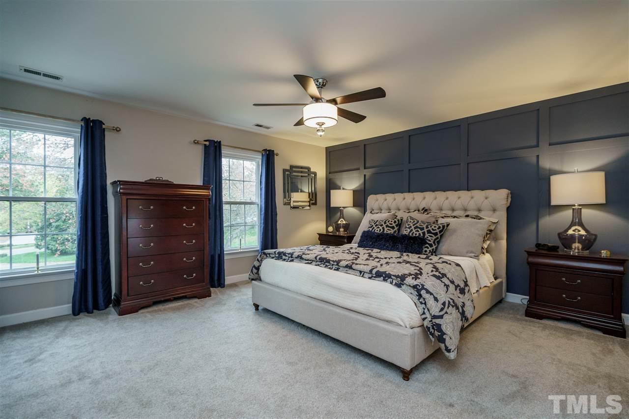 772 Weathergreen Drive Raleigh, NC 27615 - Photo 2 of 26 Huge master with board & batten and 2 windows for lots of natural light.