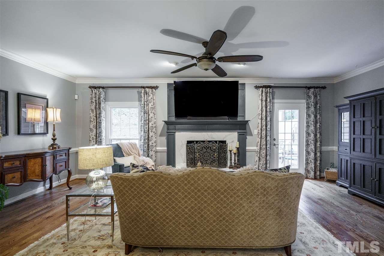 772 Weathergreen Drive Raleigh, NC 27615 - Photo 11 of 26 New ceiling fan and gleaming hardwoods.