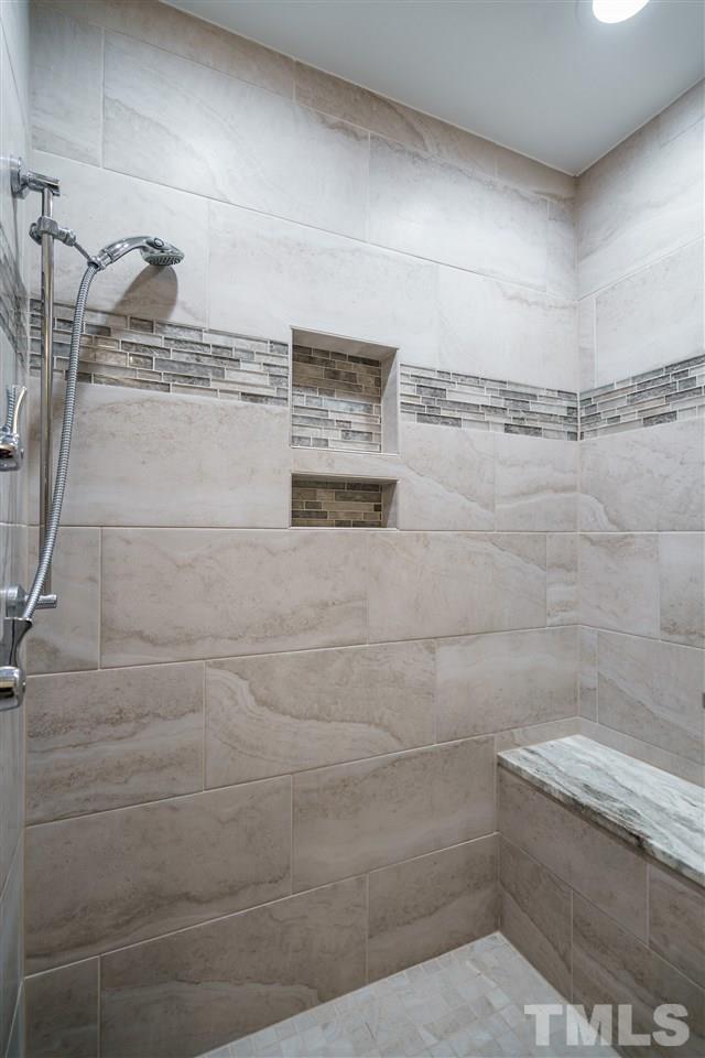 772 Weathergreen Drive Raleigh, NC 27615 - Photo 3 of 26 Walk-in frame-less shower with tile.