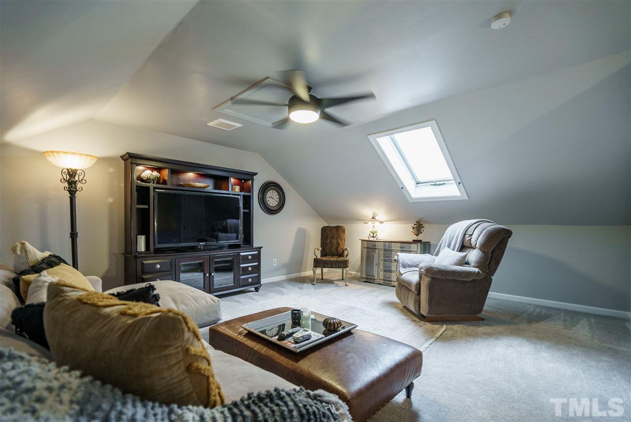 772 Weathergreen Drive Raleigh, NC 27615 - Photo 22 of 26 Huge bonus room with two walk-in closets and a skylight.