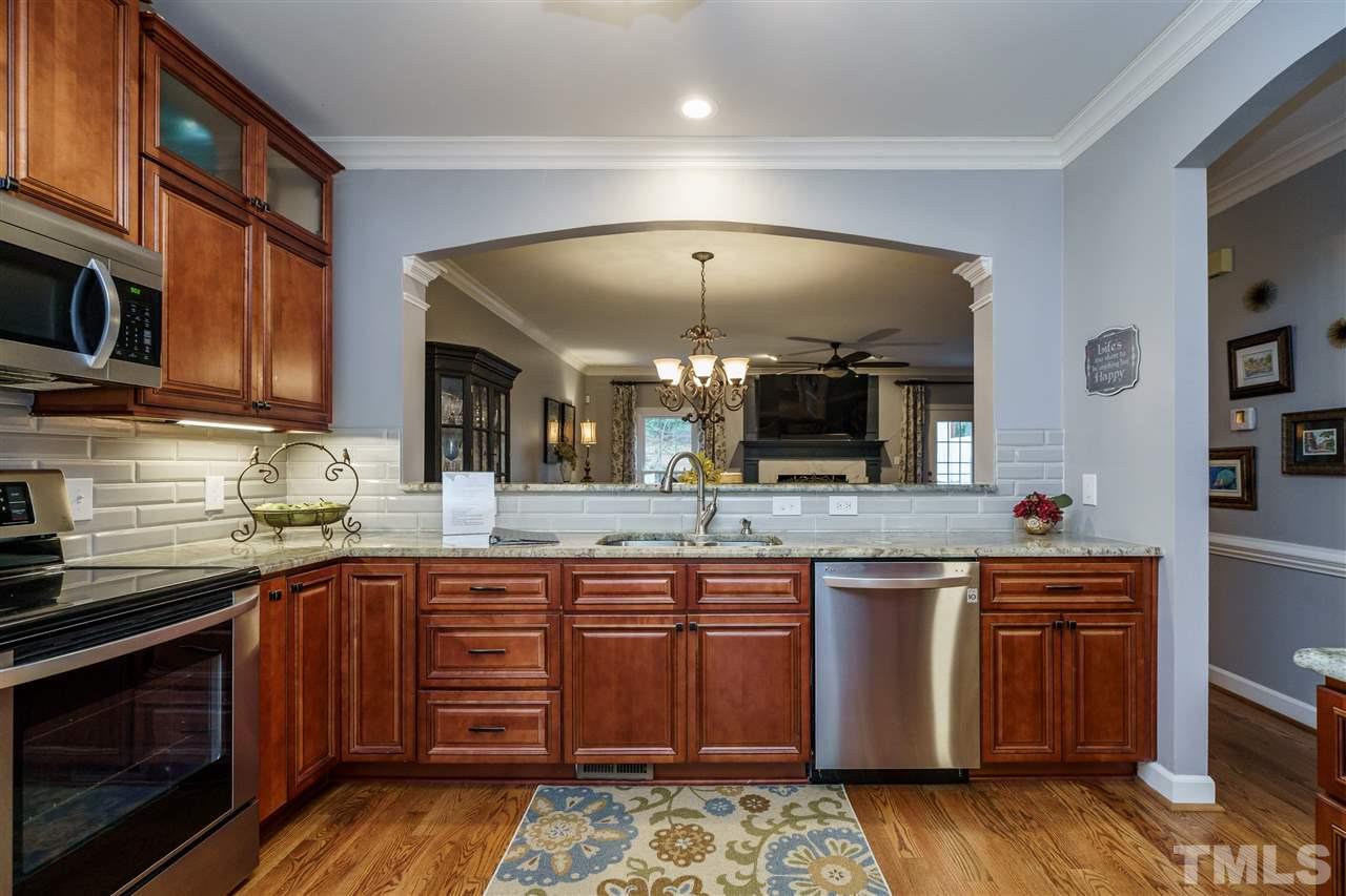 772 Weathergreen Drive Raleigh, NC 27615 - Photo 6 of 26 Open to dining area. Beveled subway tile.