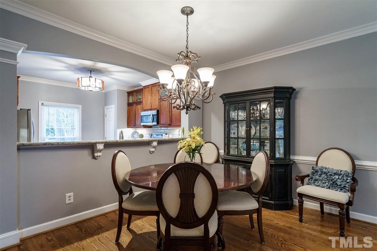 772 Weathergreen Drive Raleigh, NC 27615 - Photo 10 of 26 Large dining with gleaming hardwoods.