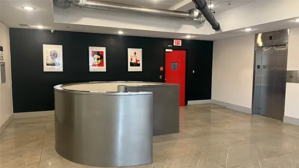 a view of a refrigerator in a kitchen