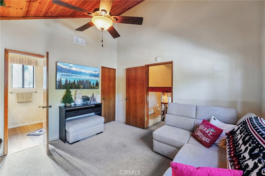 1847 Thrush Road Wrightwood, CA 92397 - Photo 16 of 33 a living room with furniture and a large window