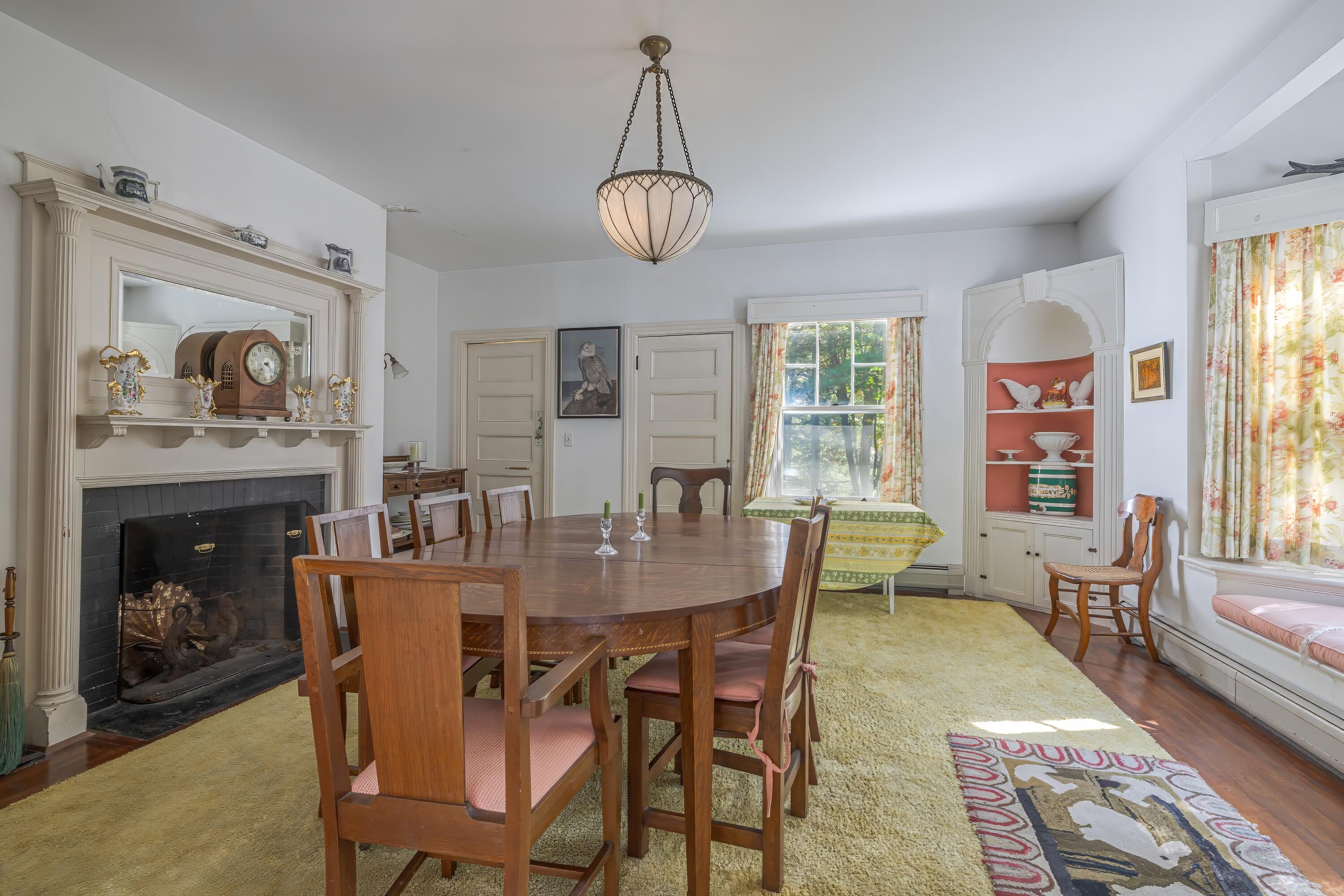 18 Rock End Road Mount Desert, ME 04662 - Photo 11 of 32 Dining room with fireplace
