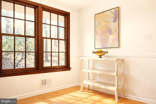 a view of a room that has a window and couch