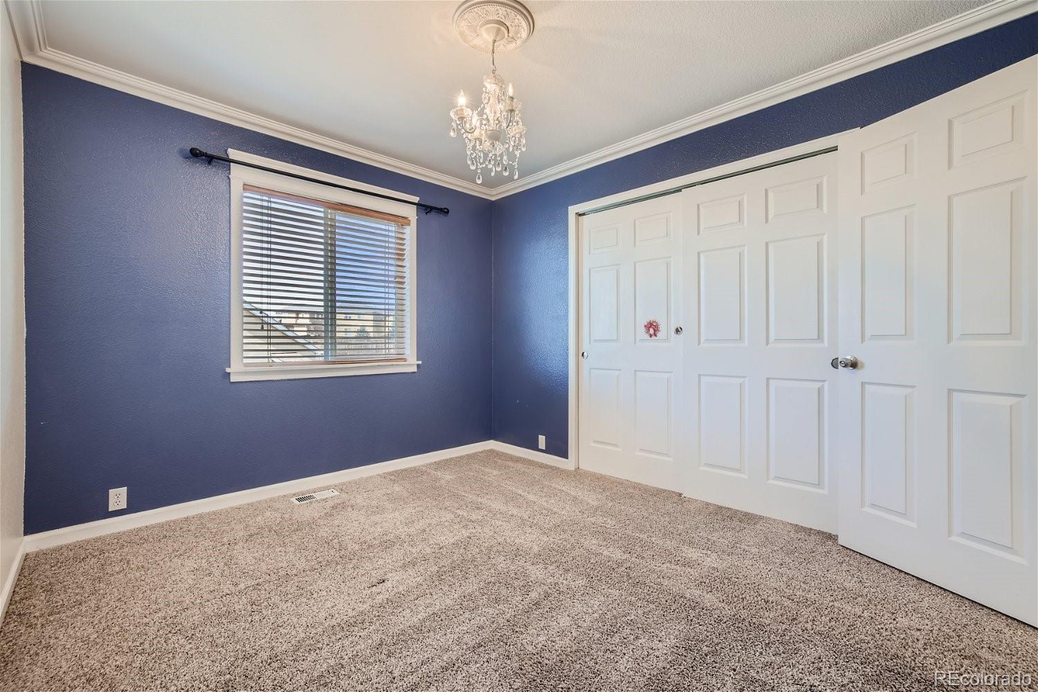 6632 Balance Circle Colorado Springs, CO 80923 - Photo 17 of 28 a view of an empty room with a window