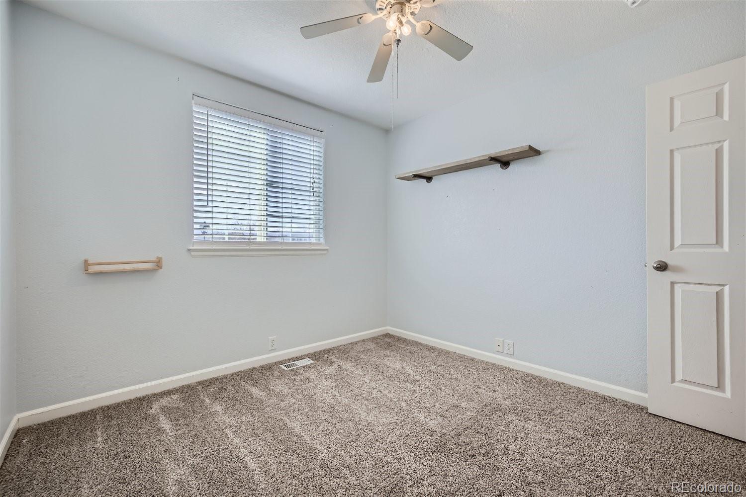 6632 Balance Circle Colorado Springs, CO 80923 - Photo 20 of 28 a view of an empty room with a window