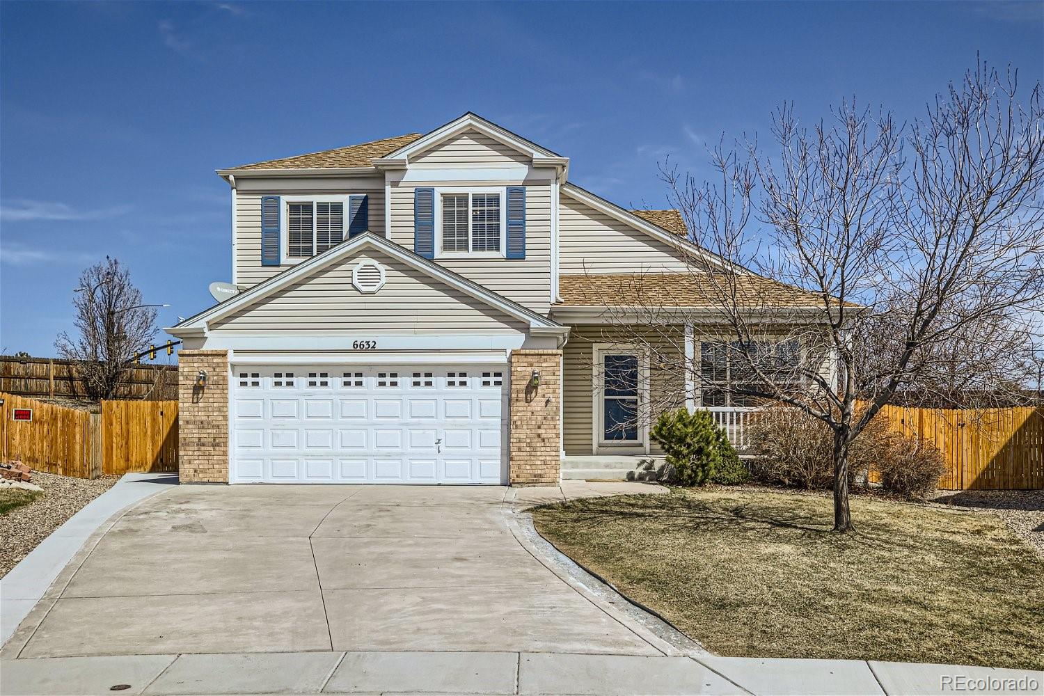 6632 Balance Circle Colorado Springs, CO 80923 - Photo 2 of 28 a front view of a house with a yard