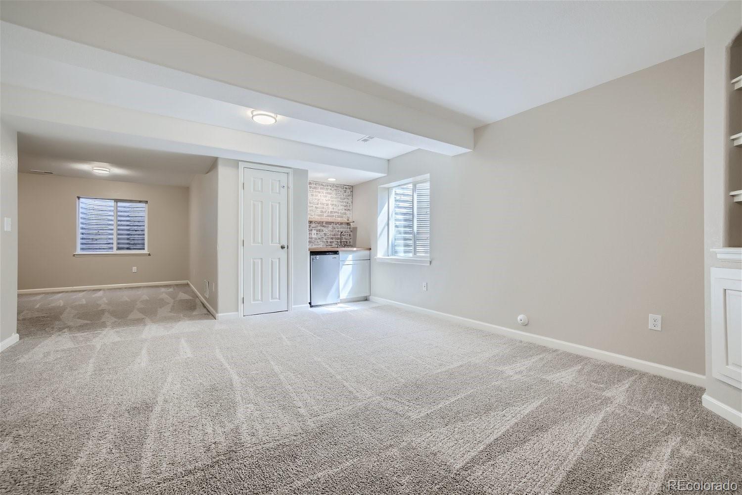 6632 Balance Circle Colorado Springs, CO 80923 - Photo 22 of 28 a view of empty room with a fireplace and window
