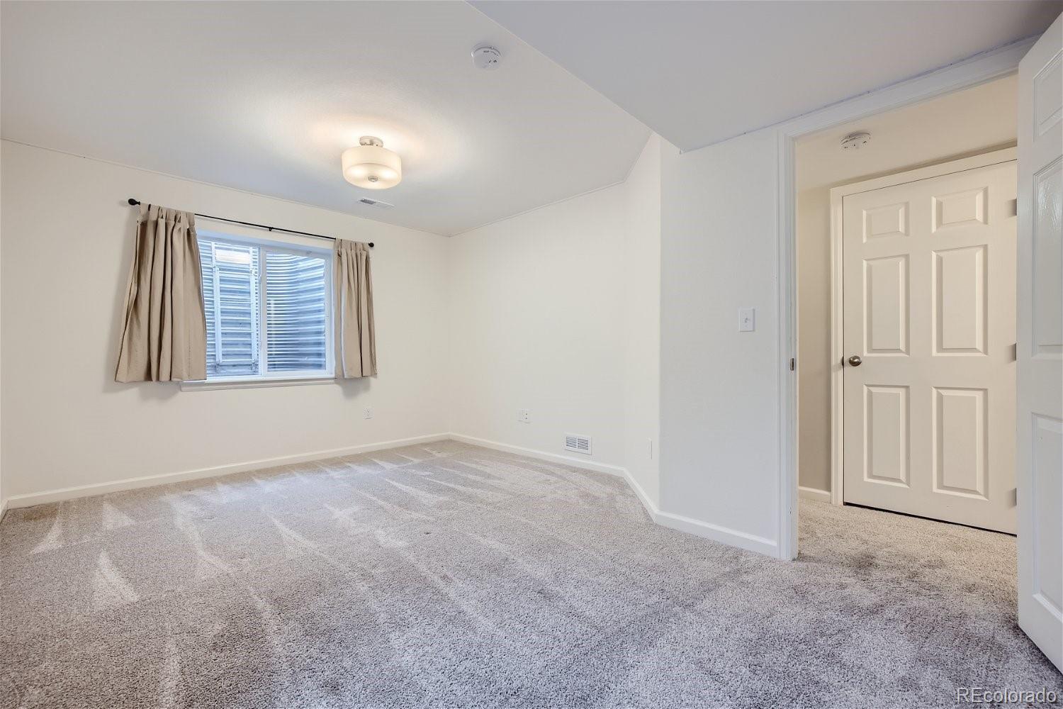 6632 Balance Circle Colorado Springs, CO 80923 - Photo 24 of 28 an empty room with windows