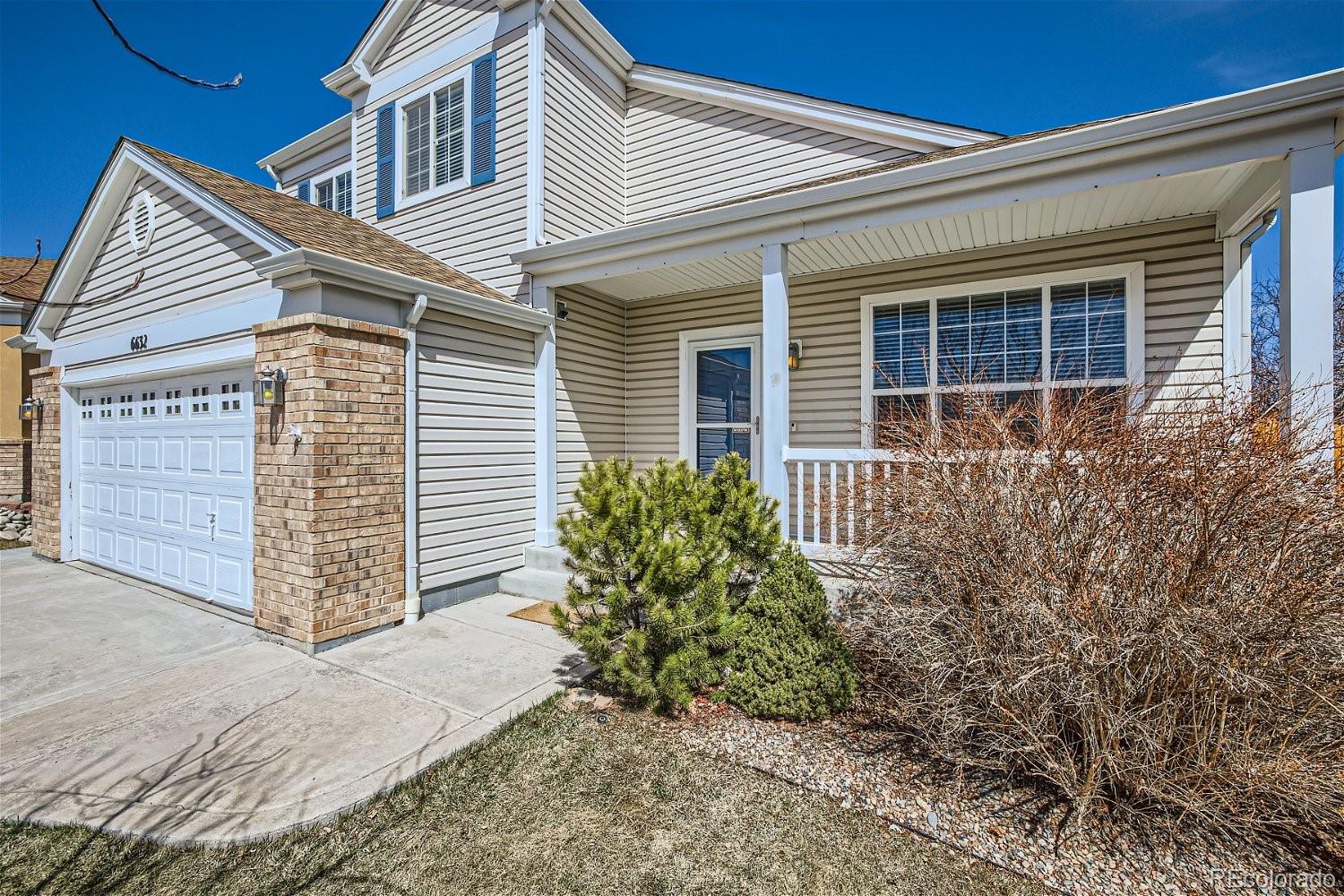 6632 Balance Circle Colorado Springs, CO 80923 - Photo 3 of 28 a front view of a house with garden