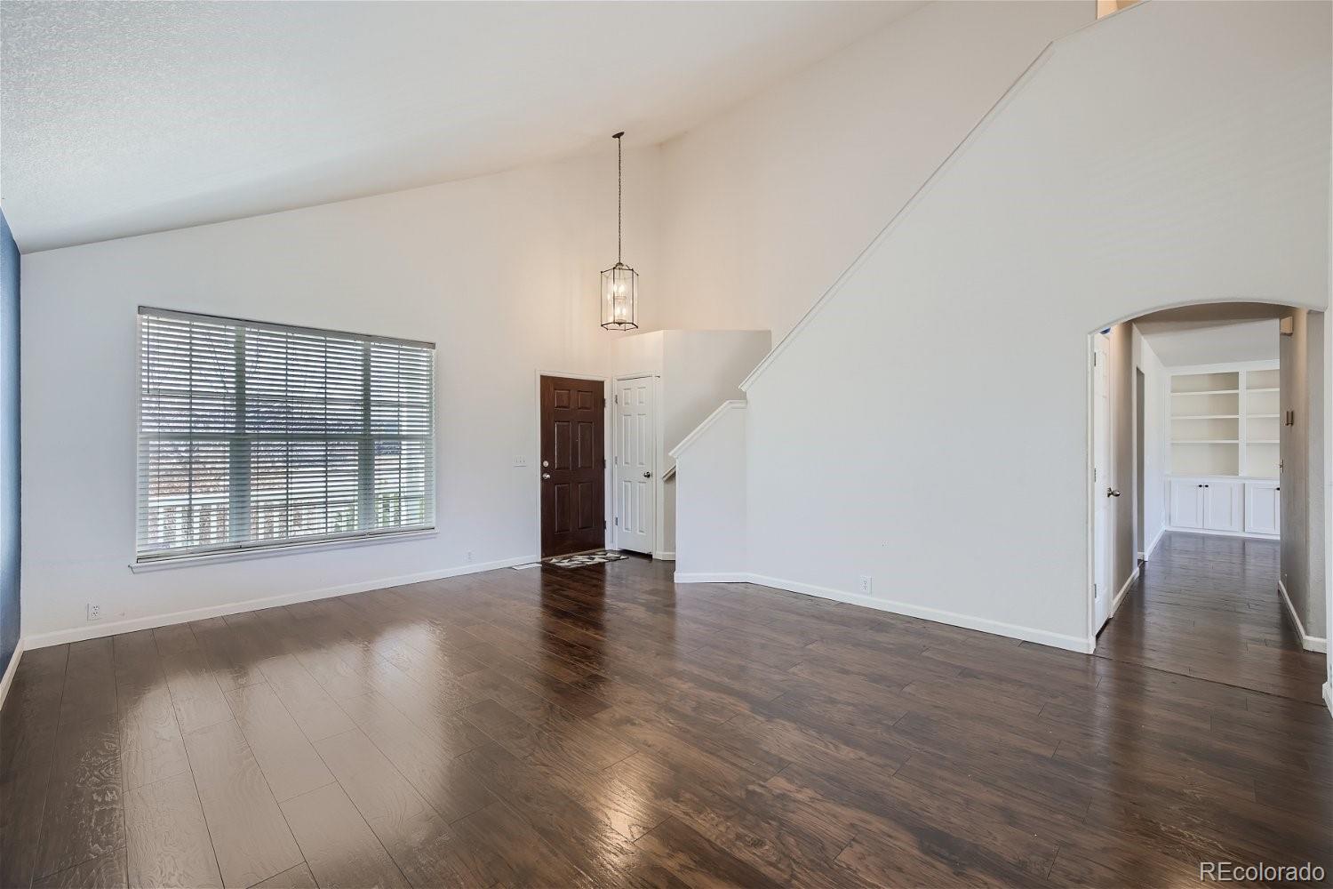6632 Balance Circle Colorado Springs, CO 80923 - Photo 5 of 28 an empty room with wooden floor and windows