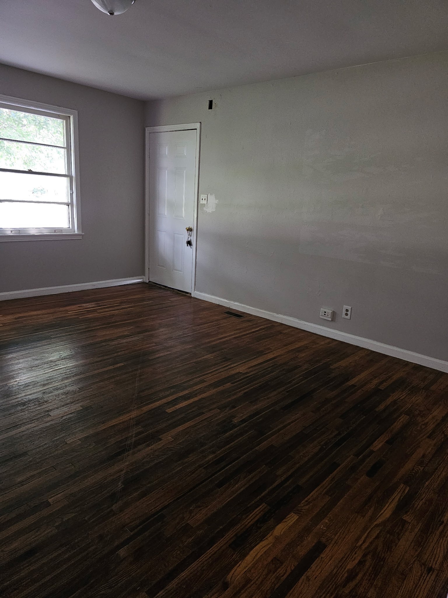 721 Kent Drive Lebanon, TN 37087 - Photo 3 of 8 a view of an empty room with wooden floor and a window