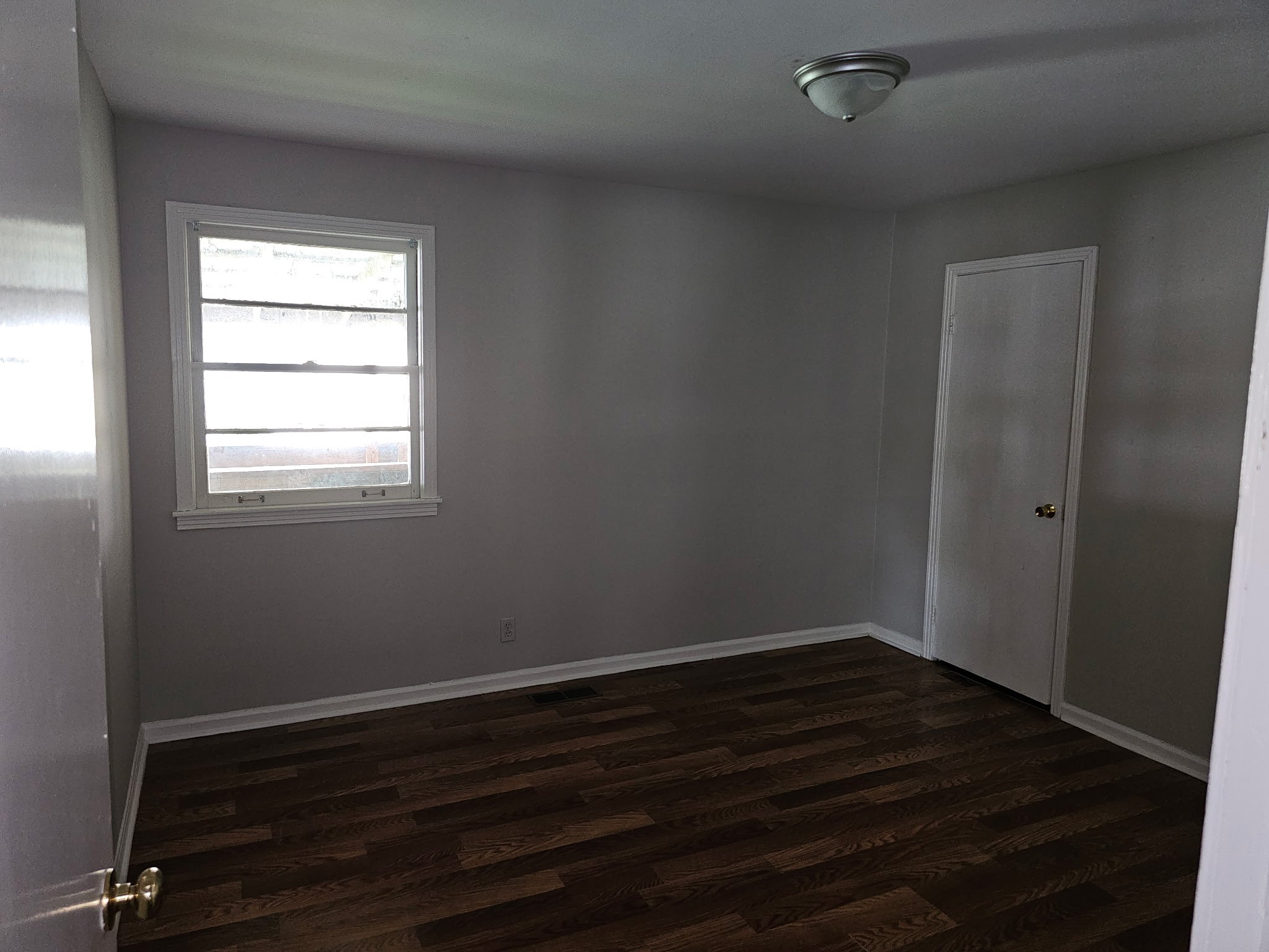 721 Kent Drive Lebanon, TN 37087 - Photo 8 of 8 an empty room with wooden floor and windows