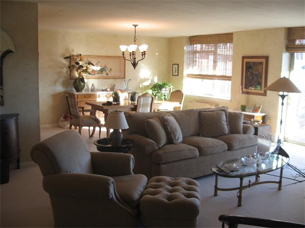 280 Boylston Street, Unit 709 Newton, MA 02467 - Photo 2 of 11 a view of a dining room with furniture and a chandelier