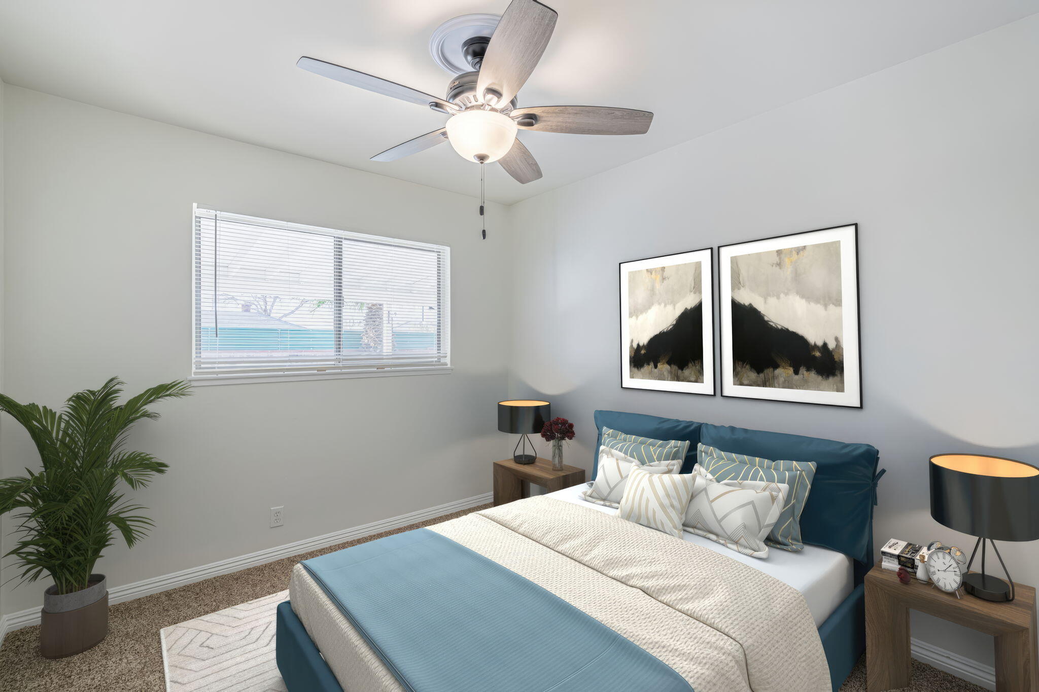 44015 Elm Avenue Lancaster, CA 93534 - Photo 11 of 22 a bedroom with a bed and a potted plant