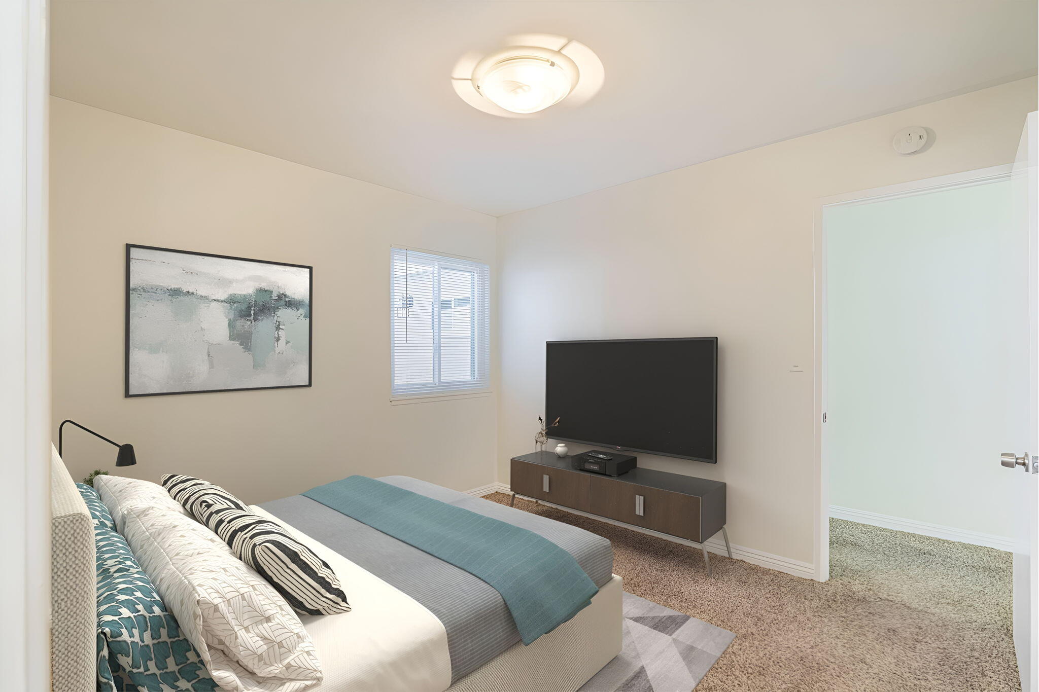 44015 Elm Avenue Lancaster, CA 93534 - Photo 12 of 22 a bedroom with a bed and a flat screen tv