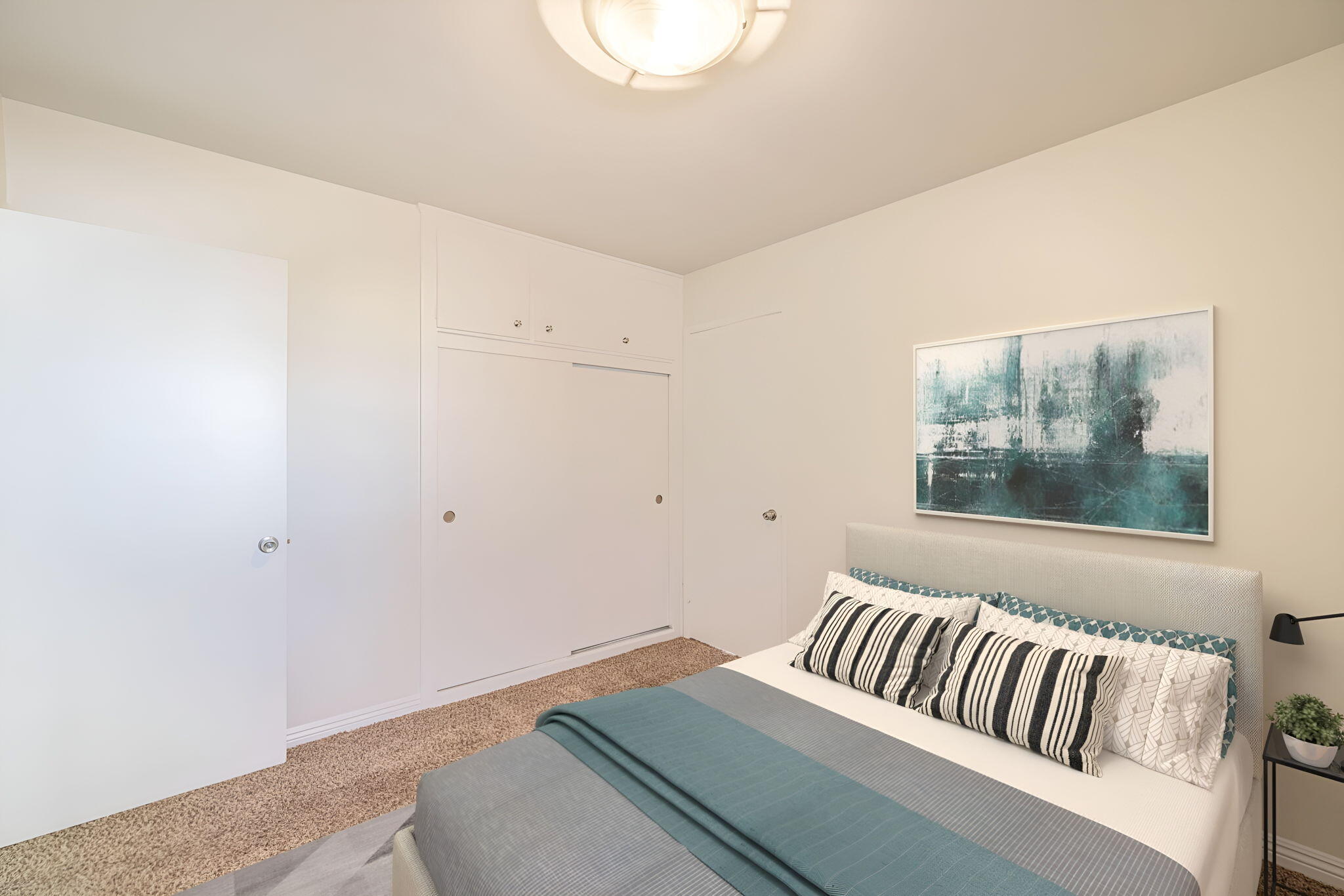 44015 Elm Avenue Lancaster, CA 93534 - Photo 13 of 22 a bedroom with a bed and window