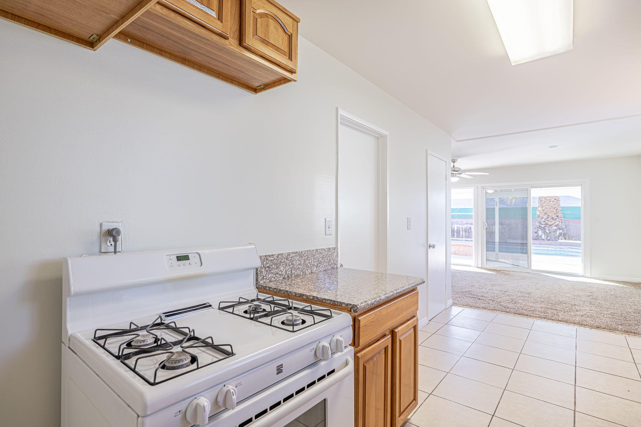 44015 Elm Avenue Lancaster, CA 93534 - Photo 15 of 22 a kitchen with a stove and a sink