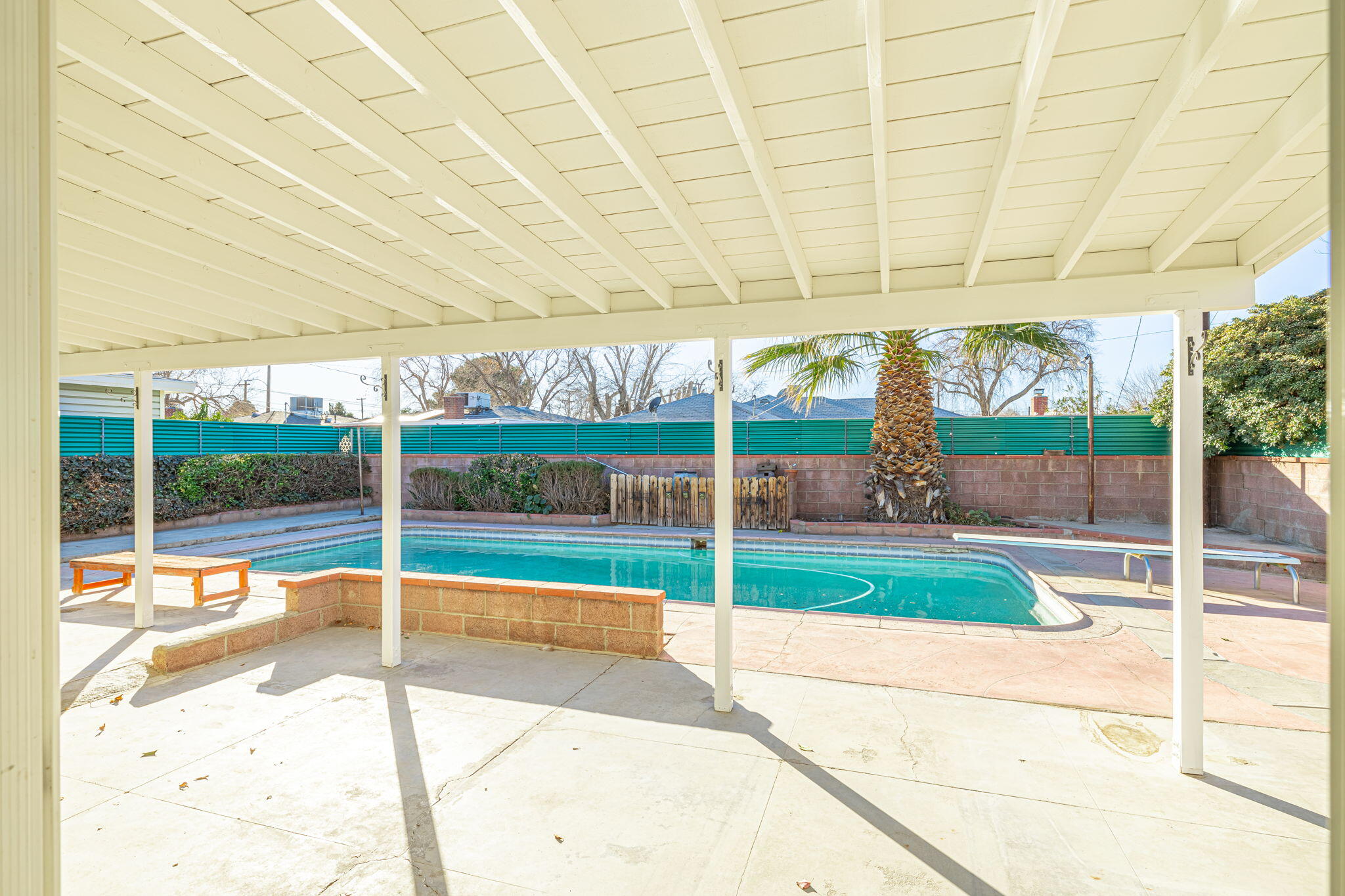 44015 Elm Avenue Lancaster, CA 93534 - Photo 17 of 22 a view of a swimming pool with a porch