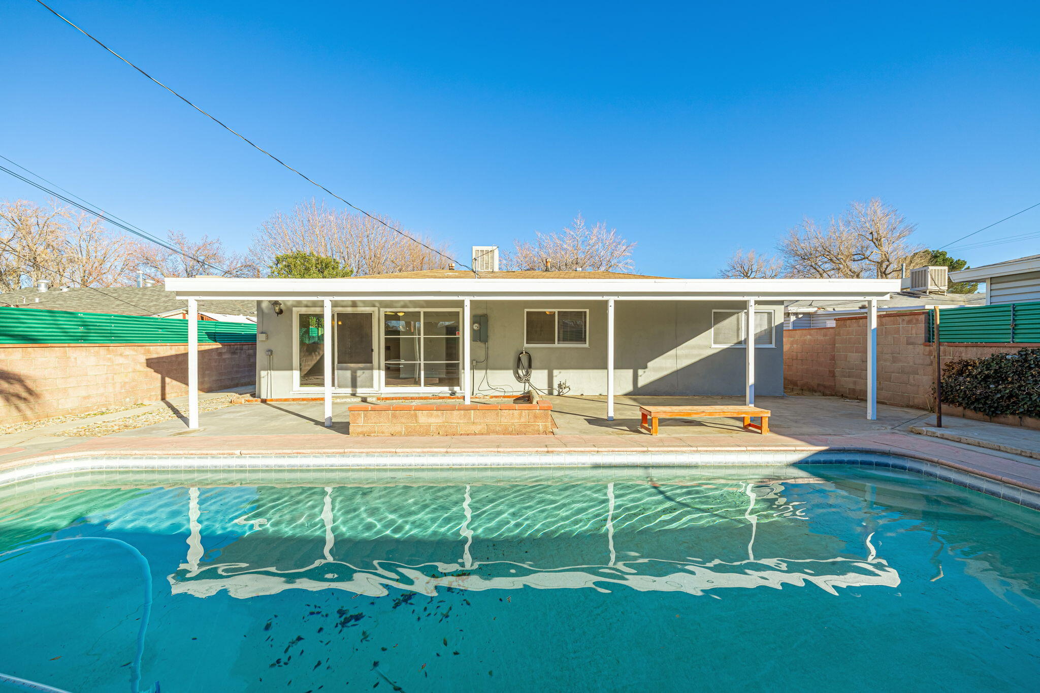 44015 Elm Avenue Lancaster, CA 93534 - Photo 20 of 22 a view of a house with backyard sitting area and garden