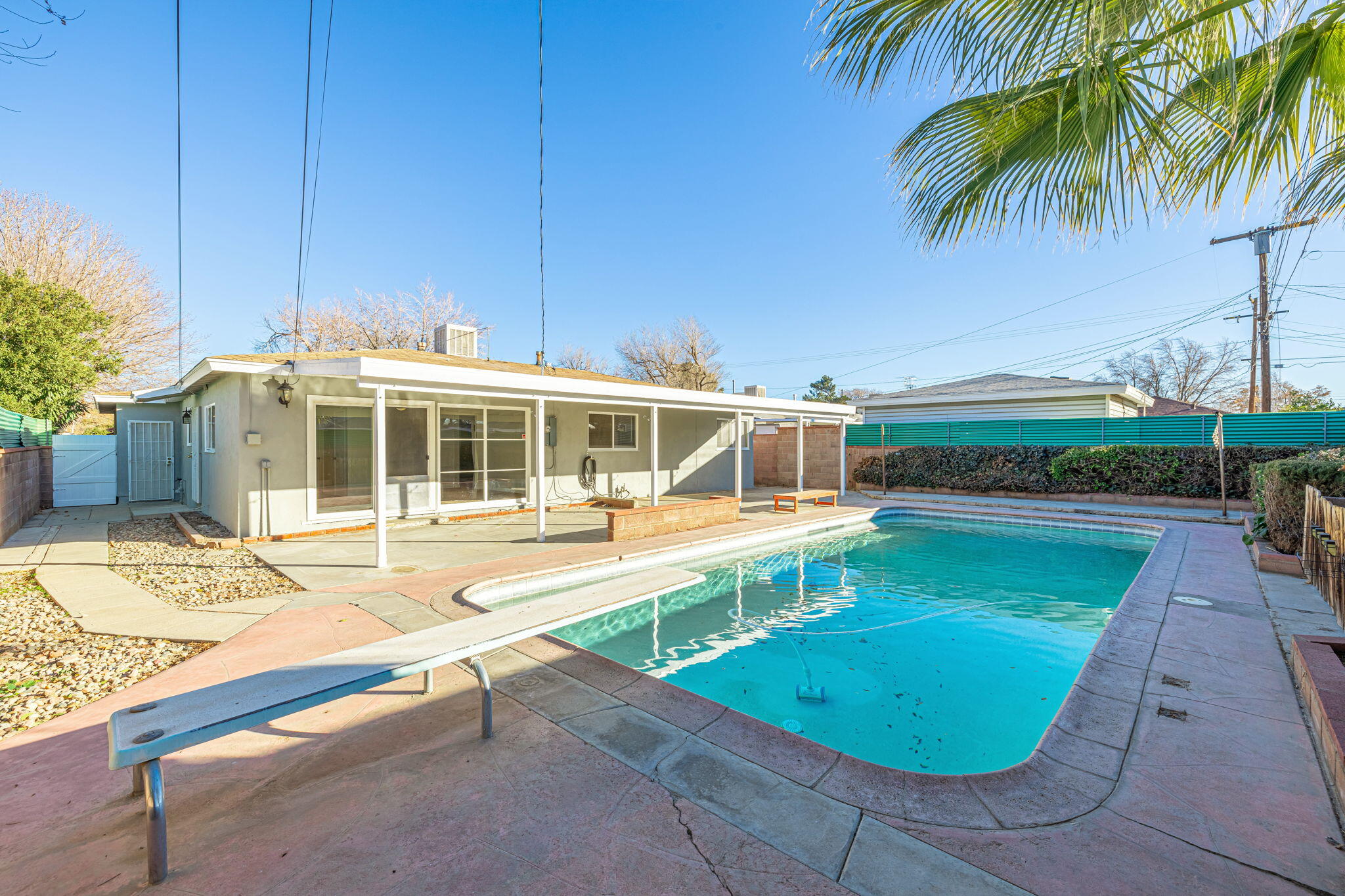 44015 Elm Avenue Lancaster, CA 93534 - Photo 21 of 22 a view of a swimming pool with a lounge chairs