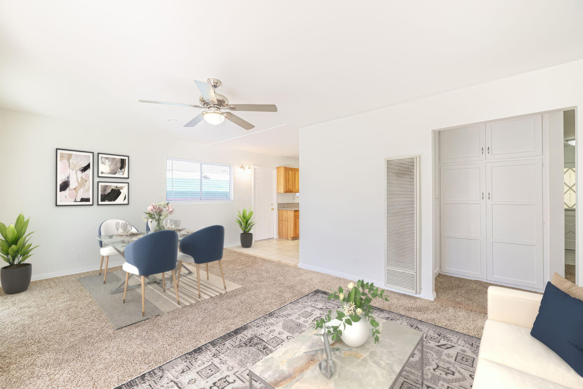 44015 Elm Avenue Lancaster, CA 93534 - Photo 5 of 22 a living room with furniture and a potted plant