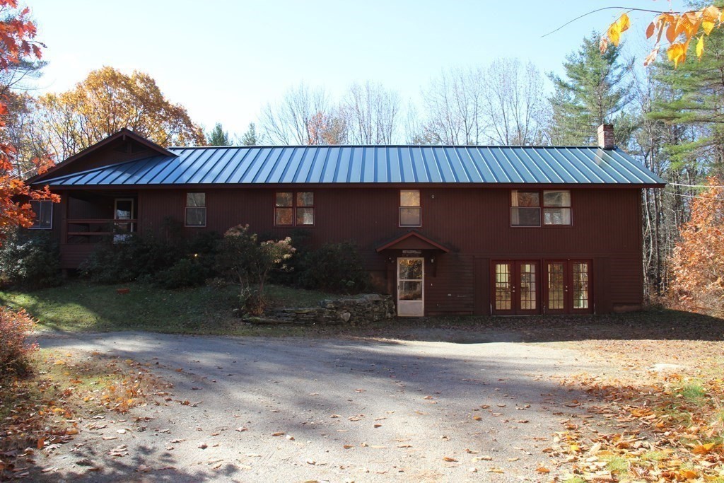 19 Ford Hill Road Rowe, MA 01367 - Photo 3 of 41 a front view of a house with garden