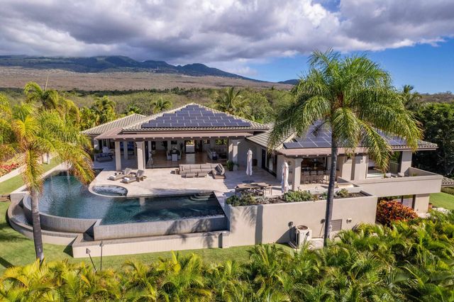 a view of a swimming pool with a yard