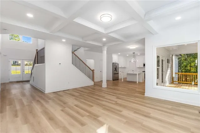 a bathroom with a granite countertop sink a toilet and shower
