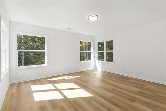 a bathroom with a toilet and a shower curtain