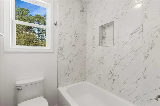 a view of an empty room with a sliding door