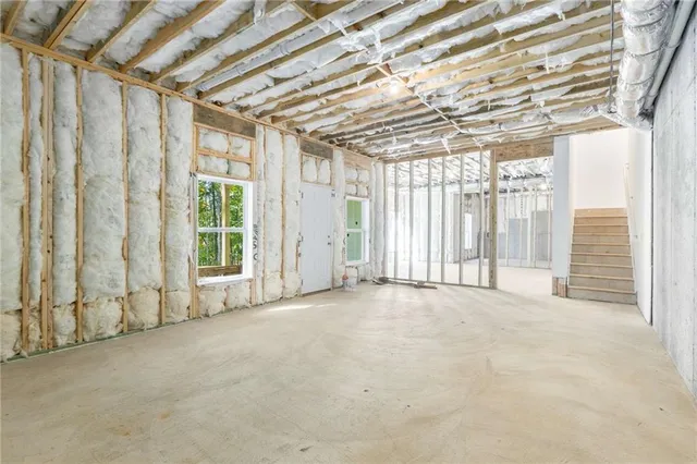 a view of a wooden deck with a yard