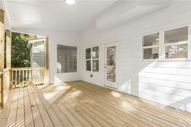 a view of a backyard with plants and outdoor seating