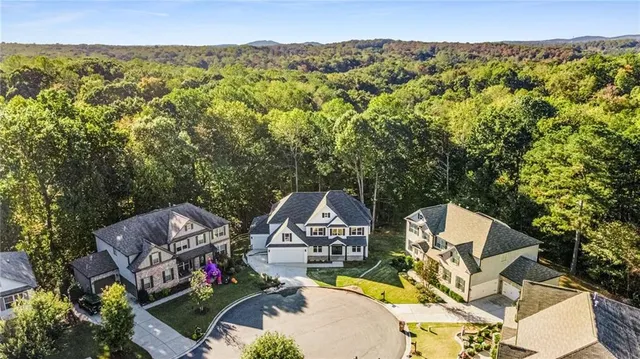 a view of a lake with lawn chairs